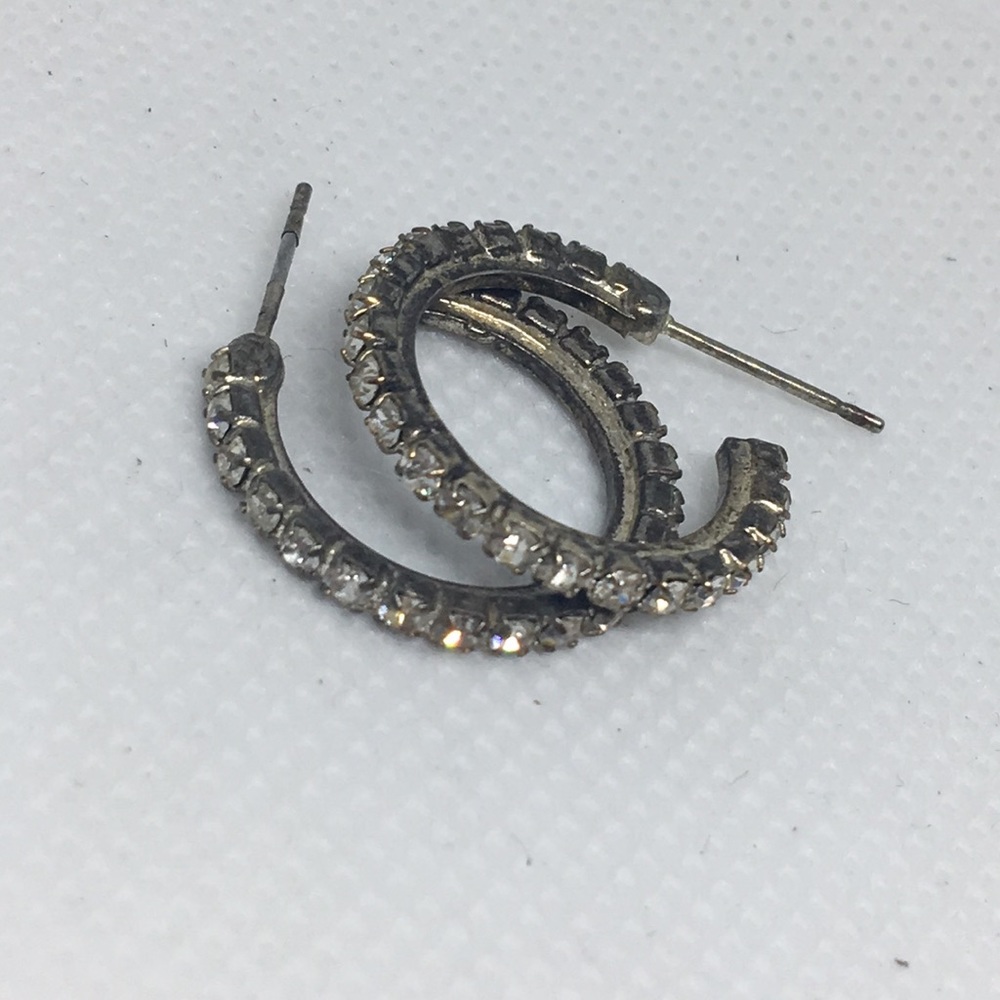 Gold diamond studded hoops.